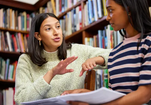 Students In Library Talking