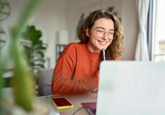 Girl Student On Laptop With Phone